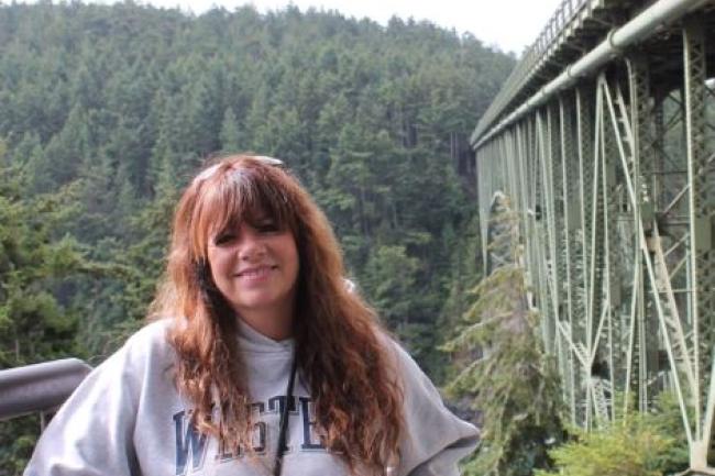 Lori Torres standing next to a bridge