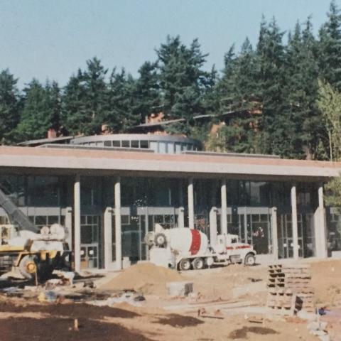 Front of SMATE under construction with a cement truck in front of the building